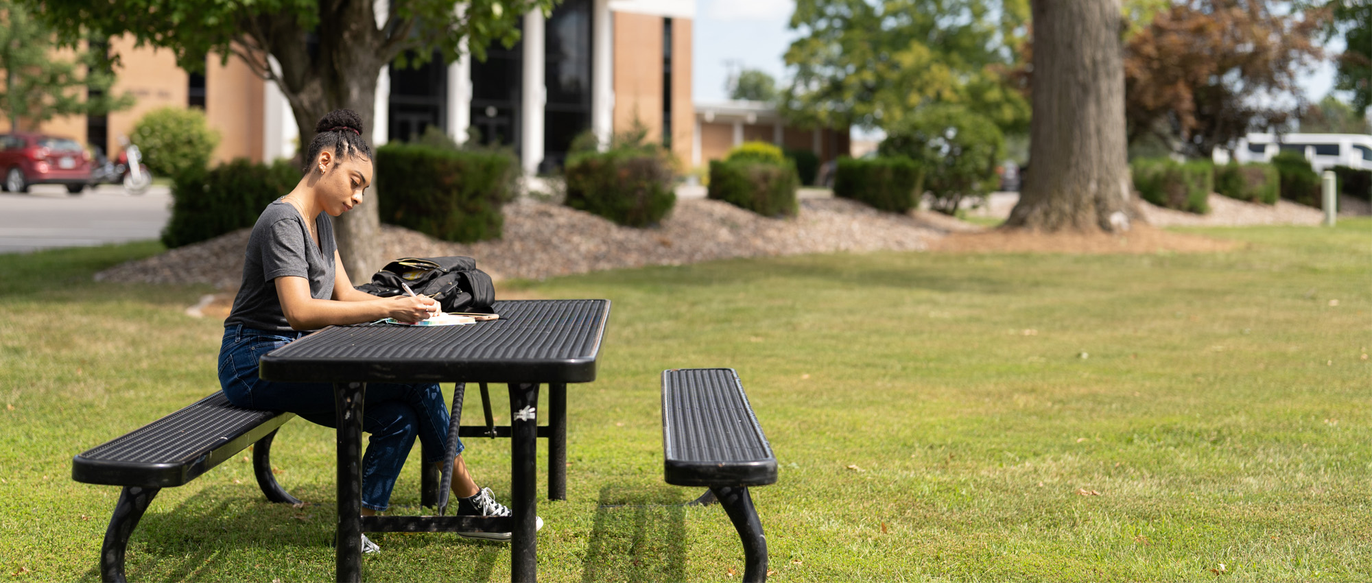 Student Studying Outside on CCCB Campus